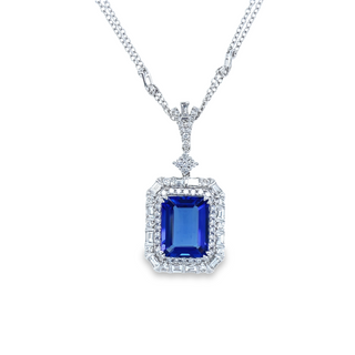18K WHITE GOLD HALO PENDANT WITH ONE 7.45CT RECTANGULAR TANZANITE  55= ROUND G-H VS2-SI1 DIAMONDS AND 13=BAGUETTE G-H VS2-SI1 1.85TW ON 18