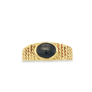 14K YELLOW GOLD RING SIZE 5 WITH ONE 1.50CT CABOCHON BLACK STAR SAPPHIRE  GRAM WEIGHT: 3.49 (ESTATE ITEM:  ALL SALES FINAL  AS IS  NO WARRANTY)
