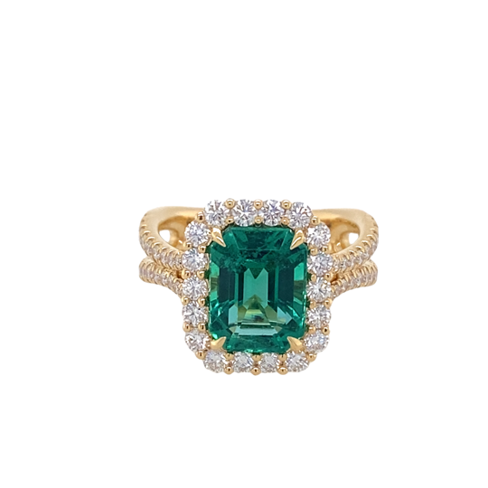 18K YELLOW GOLD HALO RING WITH ONE = 3.07CT EMERALD CUT NATURAL EMERALD IIGJ REPORT: 10353C21617 AND 62 = 0.99TW ROUND G VS2 DIAMONDS  GRAM WEIGHT: 7.23  (EMERALD TREATMENT : INDICATIONS OF CLARITY ENHANCEMENT WITH OIL IN FISSURES.  EXTENT: F1 (MINOR))
