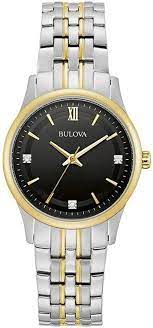 BULOVA LADIES TWO TONE STAINLESS STEEL AND GOLD TONE WATCH WITH BLACK DIAL AND THREE DIAMOND MARKERS