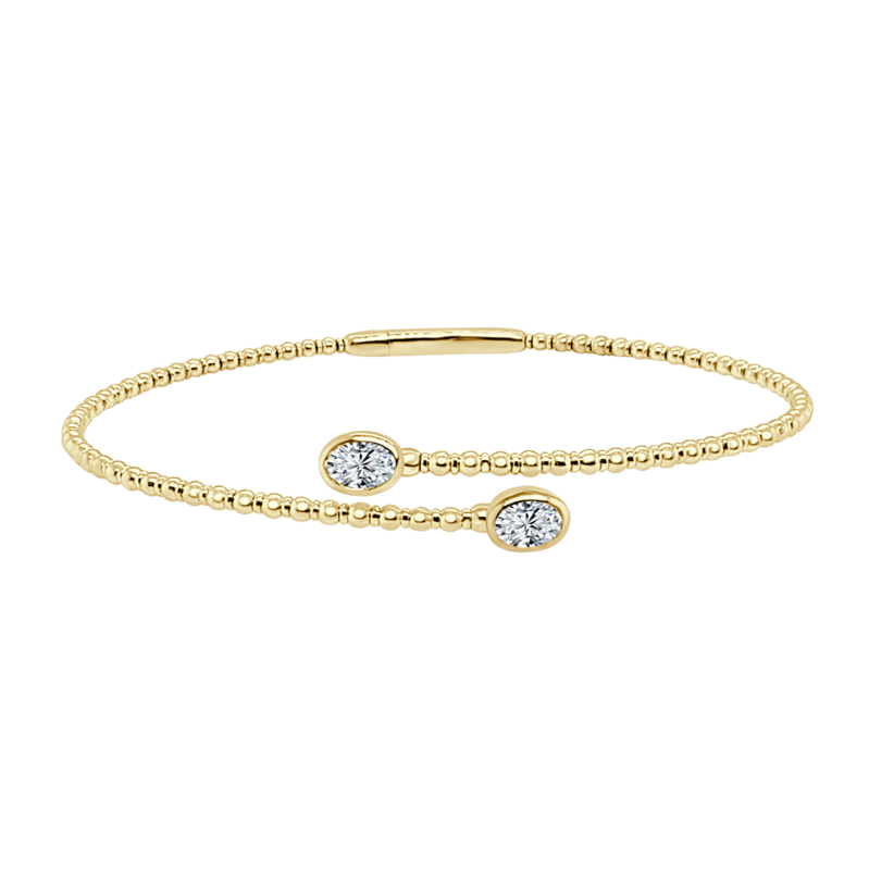 14K YELLOW GOLD BEADED BANGLE DIAMOND BRACELET WITH 2 = 0.62TW OVAL H SI1 DIAMONDS   (5.16 GRAMS)