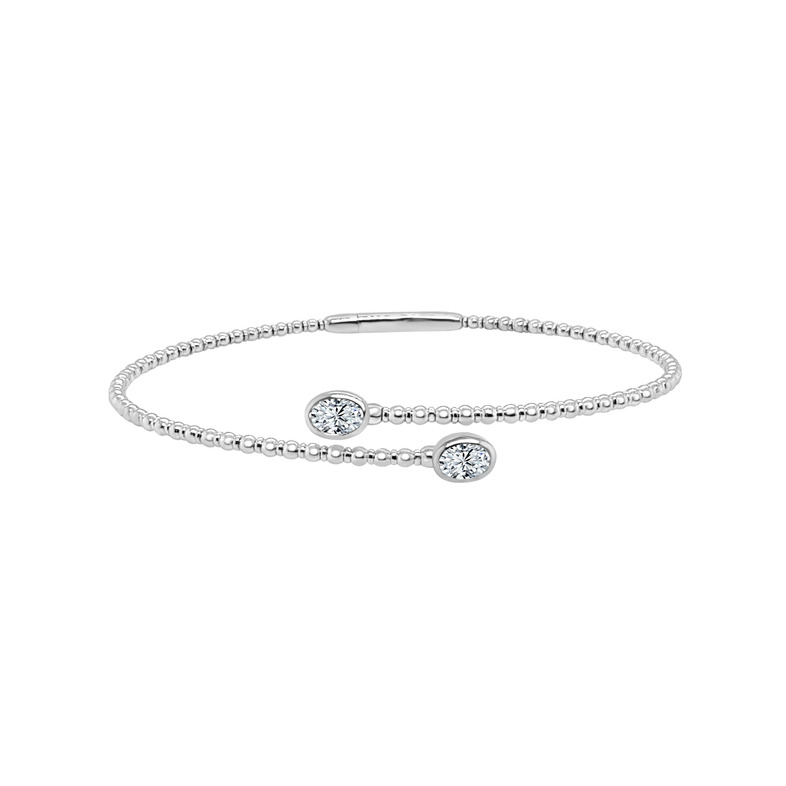 14K WHITE GOLD BEADED BANGLE DIAMOND BRACELET WITH 2 = 0.58TW OVAL I SI2 DIAMONDS   (5.18 GRAMS)