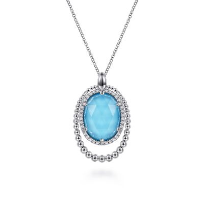 BUJUKAN COLLECTION STERLING SILVER BEADED HALO PENDANT WITH 32=0.26TW ROUND WHITE SAPPHIRES AND ONE OVAL 16.00 X 12.00MM ROCK CRYSTAL & SIMULATED TURQUOISE 17.5