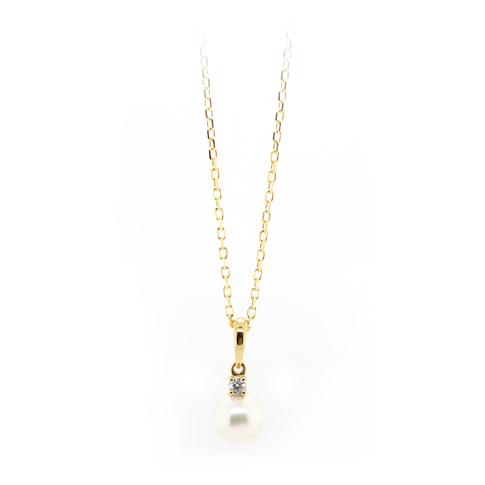 Mikimoto 18 karat yellow gold pearl and diamond pendant having smooth yellow gold bail with 1 full cut diamond prong set having a white pearl connected. Pearl is AA quality dia approx =.05ctw VSI1 - F flat oval link chain 18