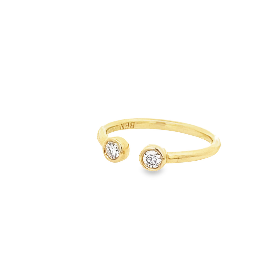 14 Karat Yellow Gold Open Diamond Ring Having 2 Full Cut Bezel Set Diamonds With A Combined Weight Of .18 Carat And Graded G-H For Color And SI2-I1 For Clarity