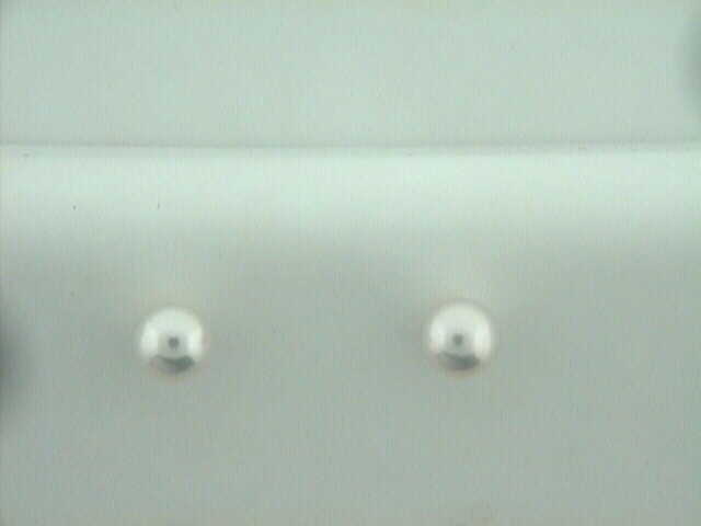 Mikimoto 18 karat white gold 6 by 6.5mm white cultured pearl stud earrings AA quality.