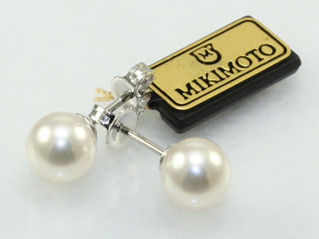 Mikimoto 18 karat white gold 7 by 7.5mm white cultured pearl stud earrings A+ quality.