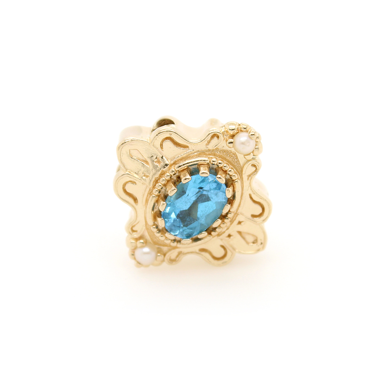 Estate Richard Glatter 14kyg slide having 1 oval blue topaz with one sead pearl at the top and  bottom.
