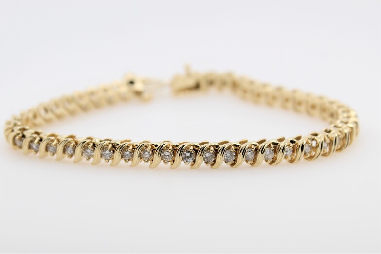 Estate 14 Karat Yellow Gold "S" Link Diamond Tennis Bracelet Having 47 Full Cut Diamonds Having An Approximate Weight Of 3.29 Carats And Graded I1 For Clarity And I-J For Color