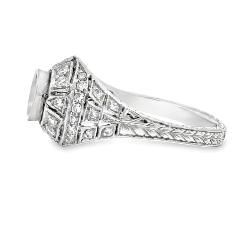 Platinum Diamond Bezel Semi Mount Ring  The ring contains a dome shape with a round bezel set head surrounded by 36 full cut diamonds with a combined weight of 0.29 carat and graded H for color and VS2 for clarity  prong set