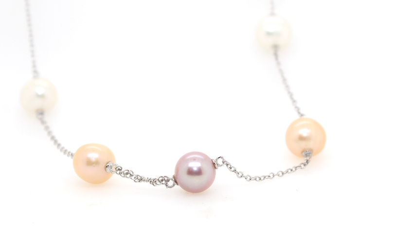 Multi color pearl station necklace with a sterling silver clasp