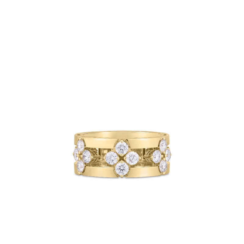 The 18 karat yellow gold ring contains 12 full cut diamonds having a combined weight of 1.05 carats and graded G-H for color and SI1-2 for clarity prong and bezel set in the shape of three flowers in t