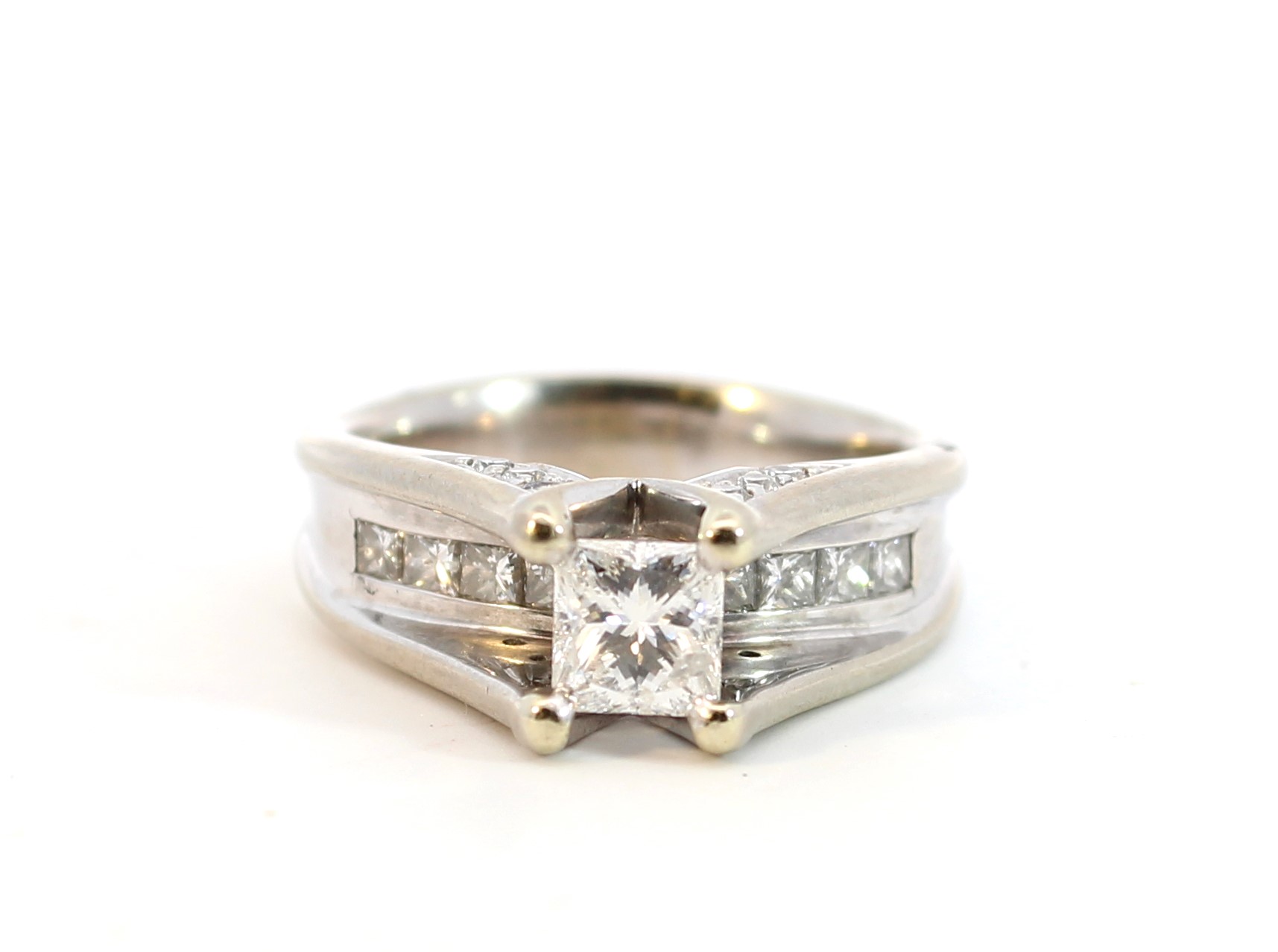 Estate 18 Karat White Gold Diamond Engagement Ring Having One Princess Cut Diamond Prong Set In A Raised Center Section Weighing Approximately 0.55 Carat Graded I1 For Clarity And I For Color