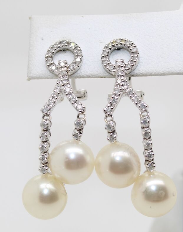 Estate 14 karat white gold diamond and pearl dangle earrings with pierced Omega backs