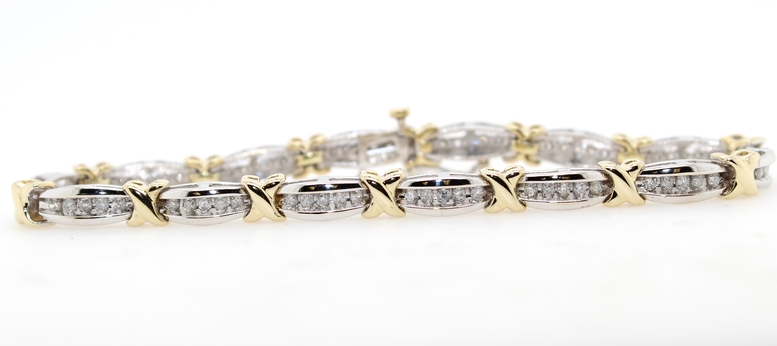 Estate 14 karat white and yellow gold diamond link bracelet measuring 7