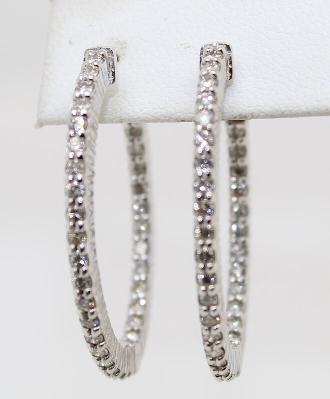 Estate 14 karat white gold oval diamond inside out hinged hoop earrings