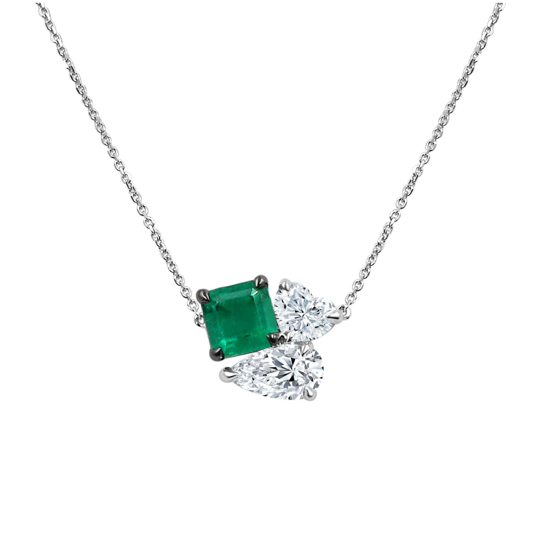 18 Karat White Gold Emerald And Diamond Necklace Measuring 18 Inches The Necklace Contains 1 Square Prong Set Emerald having a weight of 1.16 Carats With 1 Pear Shaped Diamond Weighing .74 Carat And 1 Heart Shaped Diamond Weighing .50 Carat  Both Prong Se