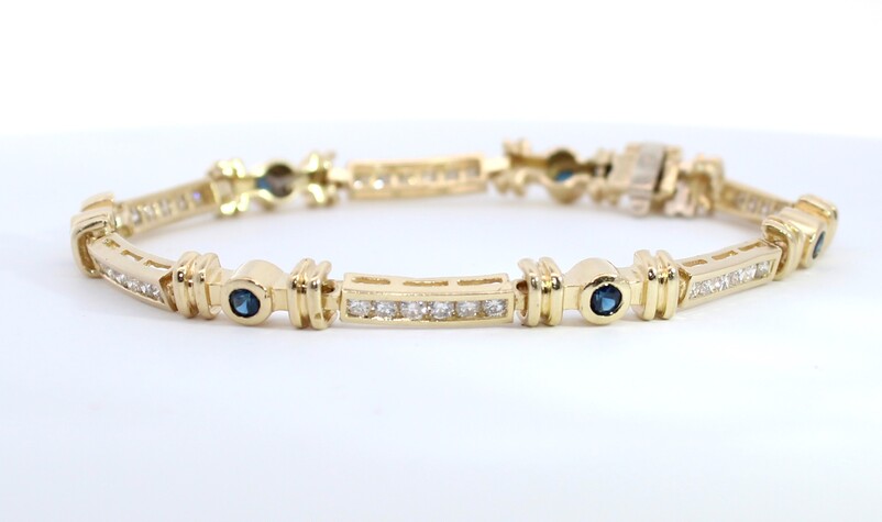 Estate 14 Karat Yellow Gold Diamond And Blue Sapphire Bracelet Measuring 7"