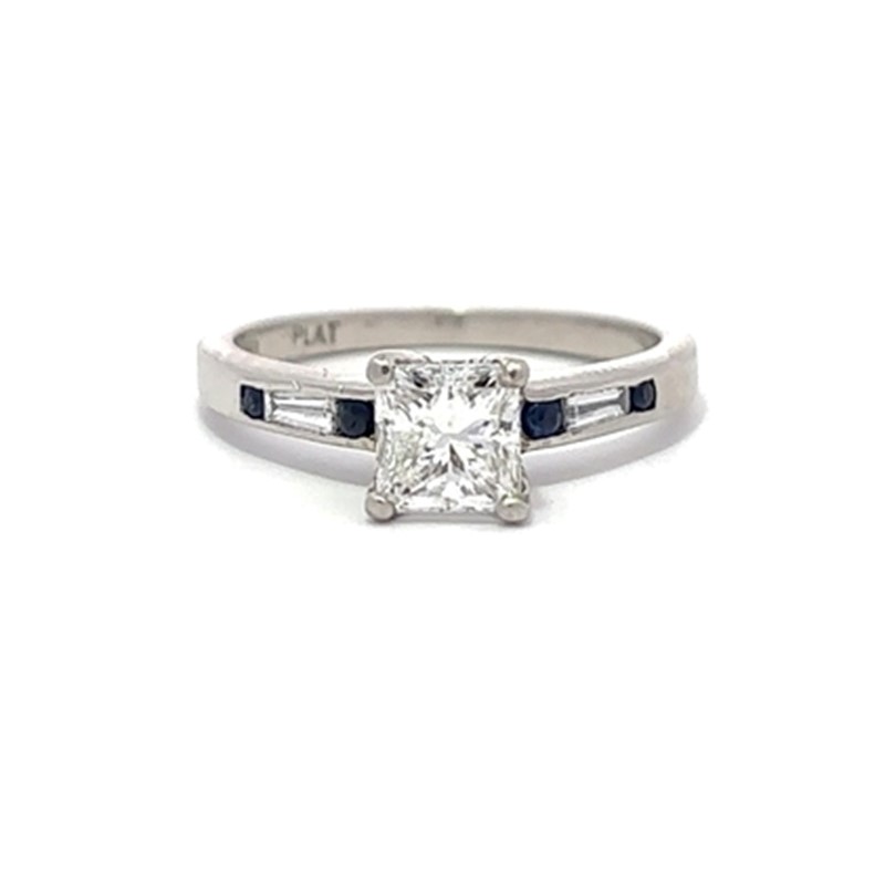 Estate Platinum Diamond And Sapphire Ring Having 1 Princess Cut Diamond Weighing Approximately 1.02 Carats And Graded Si2 For Clarity And H For Color  4 Prong Set In The Center With 2 Round Sapphires On Each Side Of The Center Having An Approximate Combin