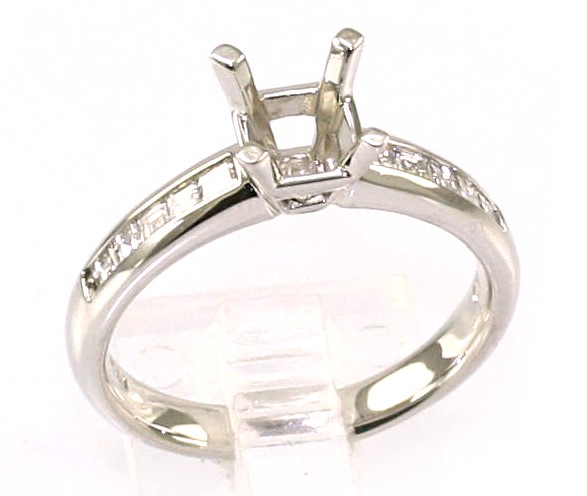 LADY'S PLAT DIA SEMI MNT RING.THE RING CONTAINS A 4 PRONG CENTER FOR A SQUARE CUT RING  WITH 5 PRINCESS CUT DIAMONDS CHANNEL SET ON EITHER SIDE