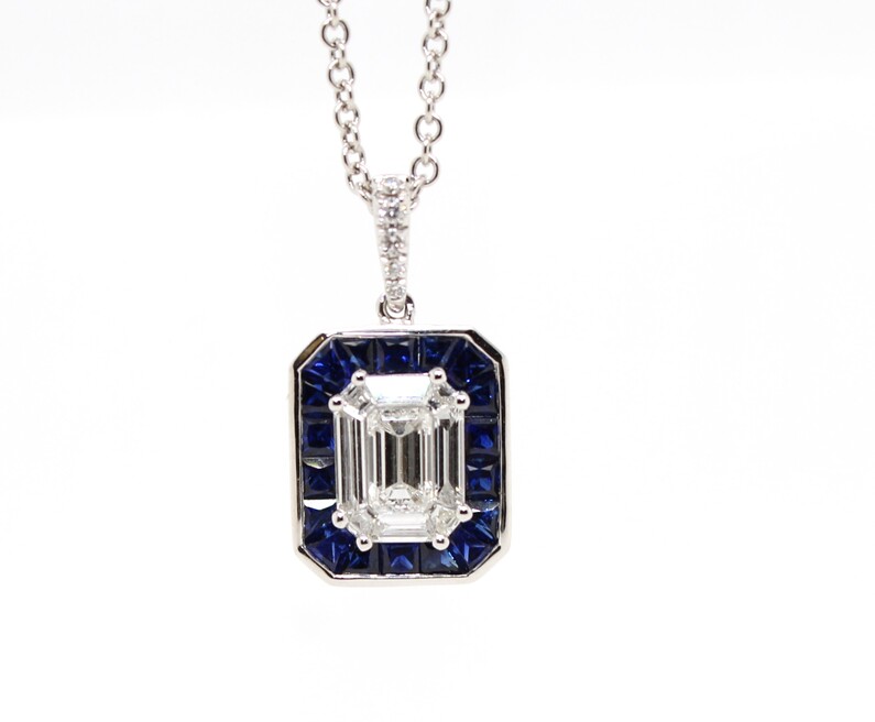 Gregg Ruth 18 Karat White Gold Diamond And Blue  Sapphire Pendant Suspended On A 16" Rolo Link Chain With A Lobster Clasp