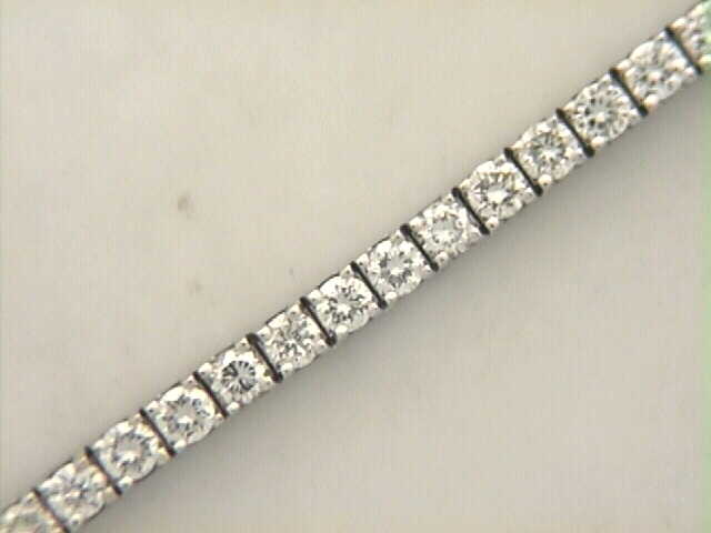 18 Karat White Gold Diamond Tennis Bracelet In The 7 Carat Category Having Full Cut Diamonds In 4-Prong Settings