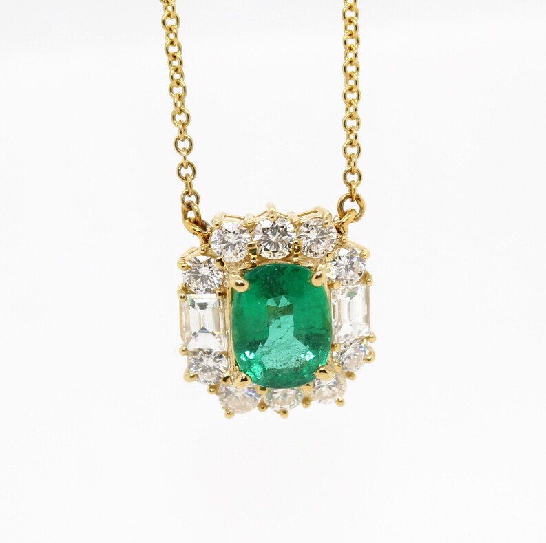 18 Karat Yellow Gold Emerald And Diamond Pendant Suspended On A 18 Inch Chain