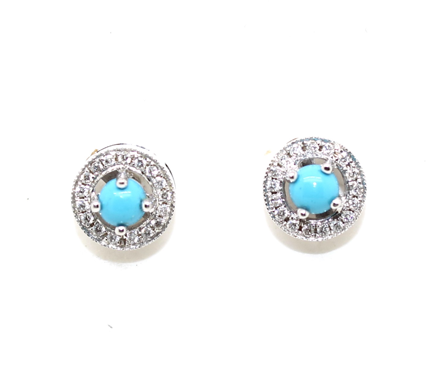 Each earring contains 1 round cut turquoise prong set in the center surrounded by 17 full cut prong set diamonds. post and friction backs. 2 turquoise = .35 carat 34 diamonds = .15 cara