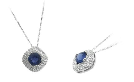 14 Karat White Gold Blue Sapphire And Diamond Pendant Suspended On A 14 Karat White Gold Chain Measuring 16" Long