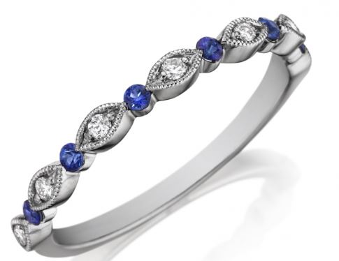 The Band Contains 6 Round Sapphires Alternating With 7 Marquise Sections Each Having 1 Full Cut Diamond. The Sapphires Weight .12 Carat. The Diamonds Weigh .08 Carat And Are Graded G-H For