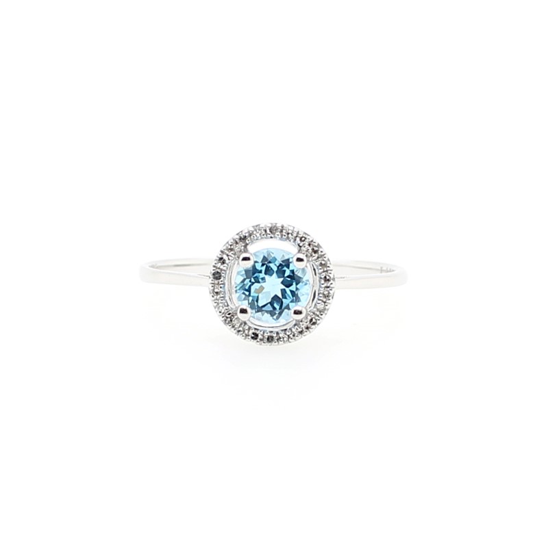 14 Karat White Gold Round Cut Blue Topaz Prong Set In The Center Surrounded By 24 Full Cut Diamonds Prong Set In A Halo Design