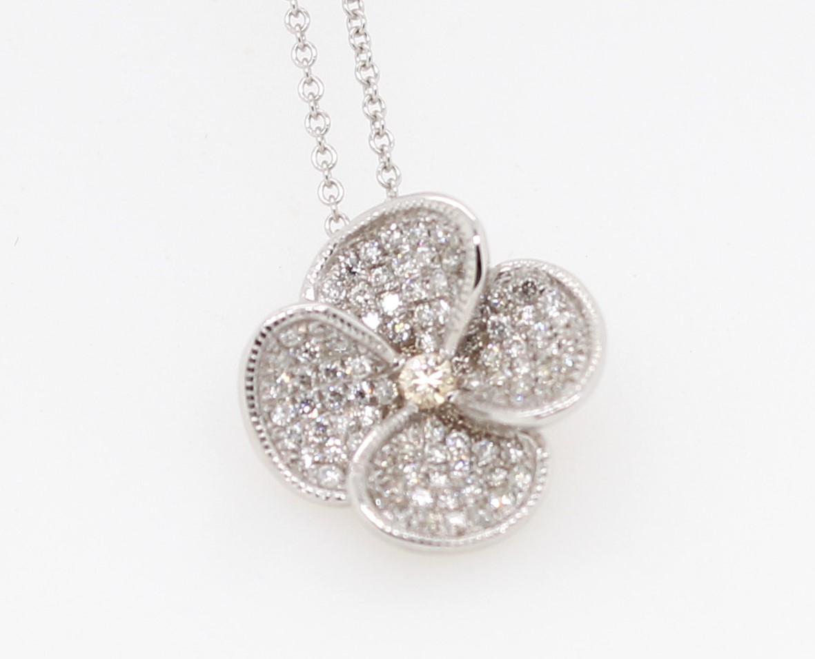 Estate 18 karat white gold diamond pendant suspended on an 16"  karat white gold round link chain