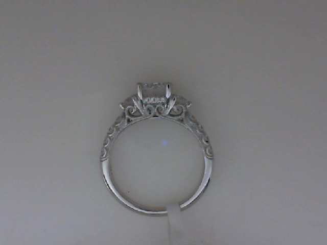14K WHITE GOLD THREE STONE SEMI MOUNTING WITH .62CTTW ROUND SI1 CLARITY & GH COLOR DIAMONDS SET ON THE SIDES, HALF WAY DOWN THE SHANK AND UNDER THE HEAD BEADED SCROLL WORK ON THE SIDES (1CT ROUND HEAD)