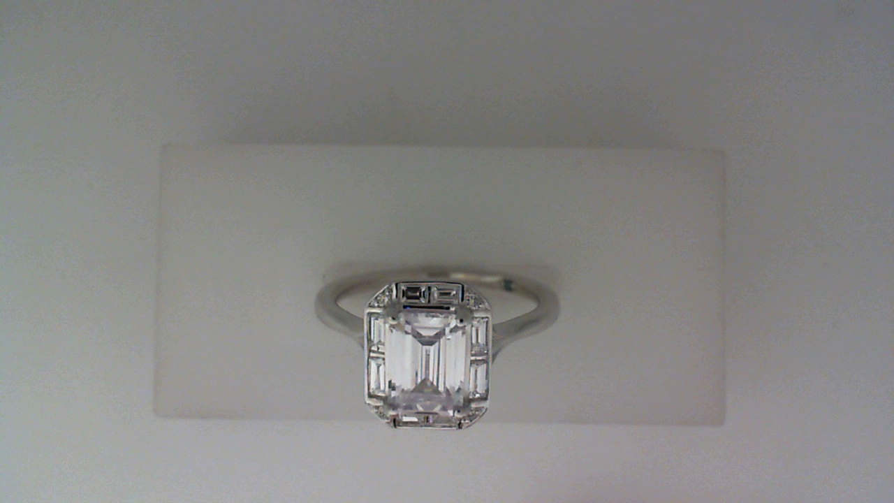 14K WHITE GOLD SEMI MOUNTING WITH .43CTTW ROUND AND BAGUETTE SI CLARITY & G COLOR IDAMONDS SET IN THE HALO AND IN THE LEAF DESIGN UNDER THE HEAD (FOR A 1CT EMERALD CENTER)