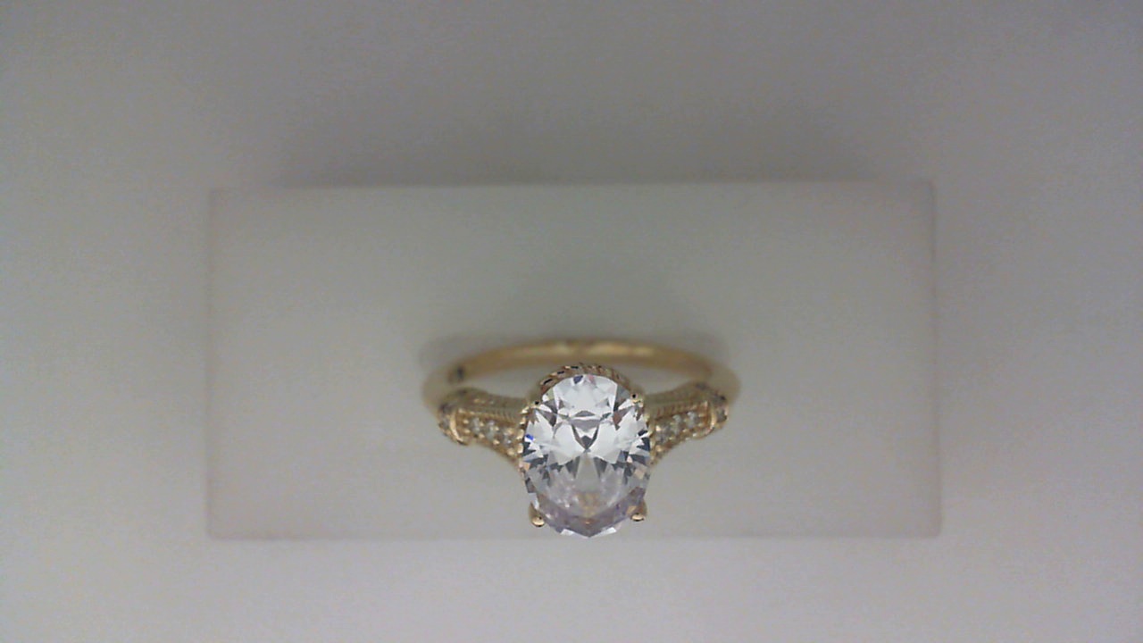 14K YELLOW GOLD FOUR PRONG SEMI MOUNTING WITH .09CTTW ROUND SI CLARITY & G COLOR DIAMONDS SET IN THE SHANK WITH BEADED HALO AND BRIDGE (FOR A 1.5CT OVAL CENTER)