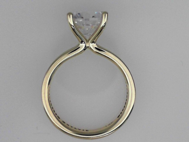 14K YELLOW GOLD FOUR PRONG SEMI MOUNTING WITH.44CTTW ROUND SI CLARITY & G COLOR DIAMONDS CHANNEL SET DOWN THE SHANK FOR A 2.5CT ROUND CENTER