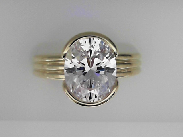 14K YELLOW GOLD TRIPLE POLISHED SHANK HALF BEZEL SEMI MOUNTING WITH .02CTTW ROUND SI CLARITY & G COLOR DIAMONDS SET UNDER THE HEAD FOR A 3CT OVAL
