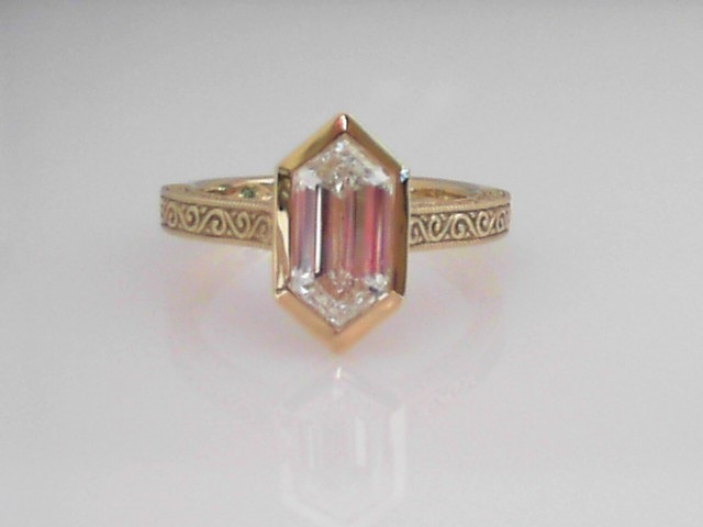 IGI REPORT #LG795672472 LABORATORY GROWN 2.04CT VVS2 CLARITY & E COLOR HEXAGONAL MODIFIED STEP CUT BEZEL SET ON AN THREE SIDED ENGRAVED 14K YELLOW GOLD SHANK *THERE IS NO TRADE IN VALUE ON LABORATORY GROWN DIAMONDS *NON-REFUNDABLE