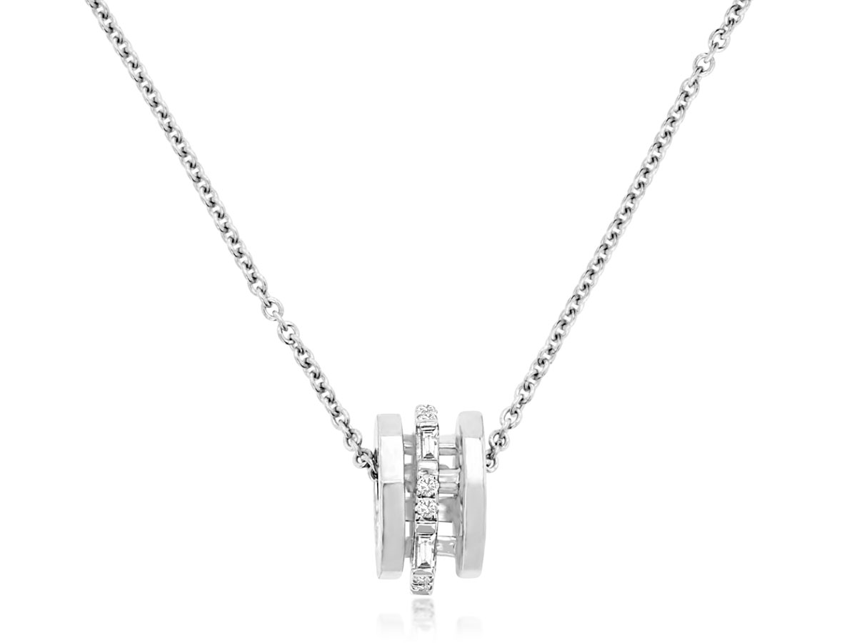 14K WHITE GOLD SPINNER PENDANT WITH .14CTTW ROUND AND BAGUETTE I1 CLARITY & HI COLOR DIAMONDS ON A PENDANT CHAIN