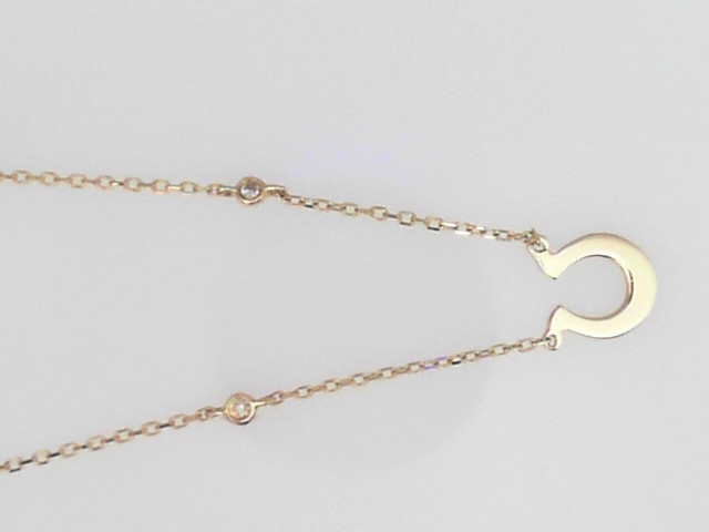 14K YELLOW GOLD HORSESHOE PENDANT WITH .04CTTW ROUND BEZEL SET DIAMOND ON A 16/18" CABLE CHAIN