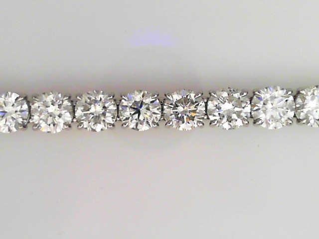 PLATINUM IN LINE BRACELET WITH 24.93CTTW (28) SI CLARITY & HI COLOR DIAMONDS SET IN FOUR PRONG BASKETS
