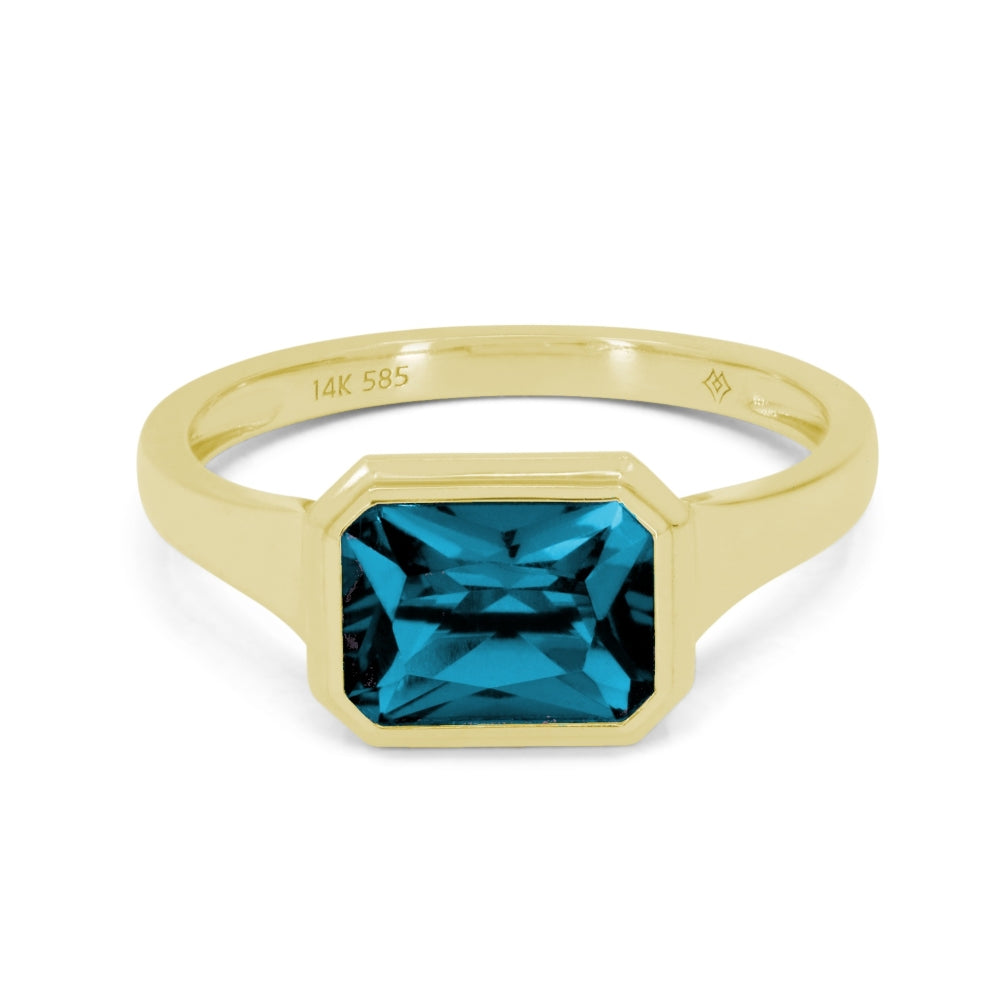 14K YELLOW GOLD 1.92CT BEZEL SET EMERALD CUT LONDON BLUE TOPAZ RING SET IN A POLISHED SETTING