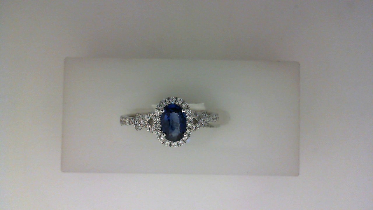 14K WHITE GOLD .55CT OVAL SAPPHIRE RING WITH .27CTTWROUND SI CLARITY & G COLRO DIAMONDS SET IN THE SIDE SHANK