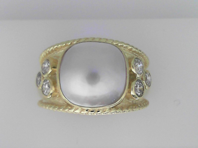 14K GREEN GOLD RING SET WITH A BEZEL SET MABE PEARL AND.60CTTW ROUND BEZEL SET SI CLARITY & G COLOR DIAMONDS WITH A SATIN FINISH