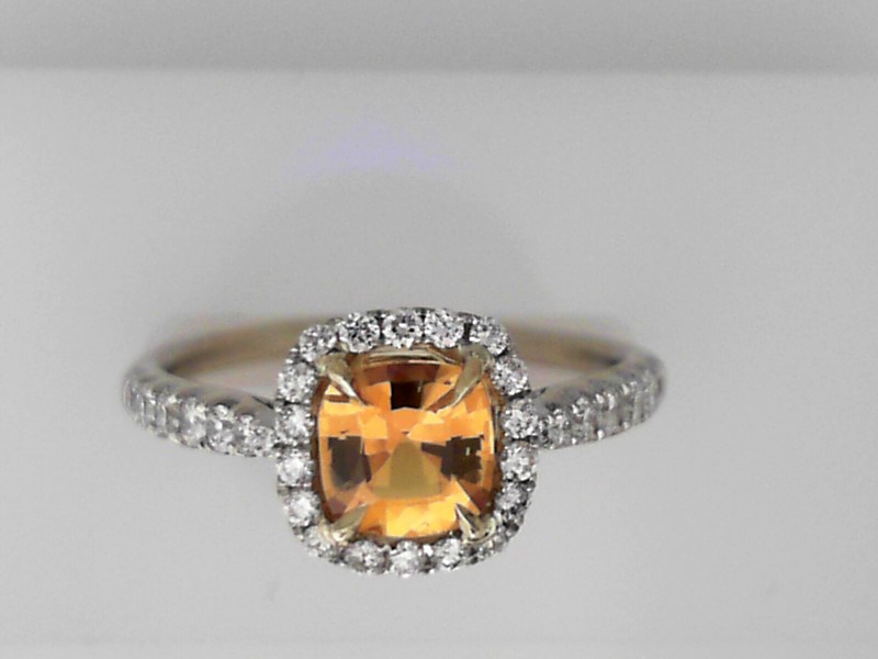 18K WHITE GOLD MOUNTING WITH .49CTTW ROUND SI1 CLARITY & G COLOR DIAMONDS SET DOWN THE SHANK AND IN THE HALO WITH A .98CT SQUARE GOLDEN SAPPHIRE CENTER SET IN 18K YELLOW GOLD