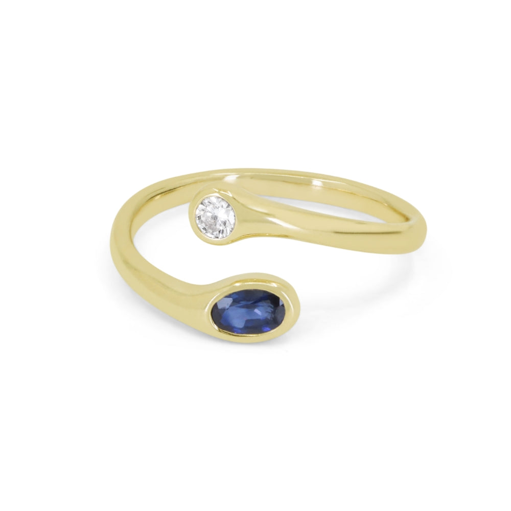 14K YELLOW GOLD OPEN BYPASS RING WITH A .33CT OVAL BEZEL SET SAPPHIRE AND A .09CT SI CLARITY & HI COLOR BEZEL SET ROUND DIAMOND