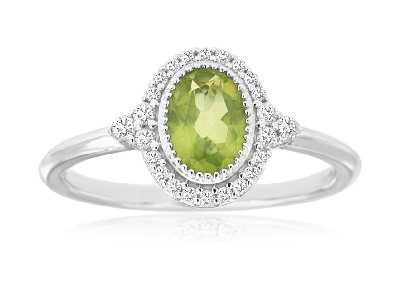 14K WHITE GOLD RING WITH A .78CT OVAL PERIDOT SET IN A BEADED BEZEL WITH .16CTTW ROUND I1 CLARITY & HI COLOR DIAMONDS SET IN THE HALO