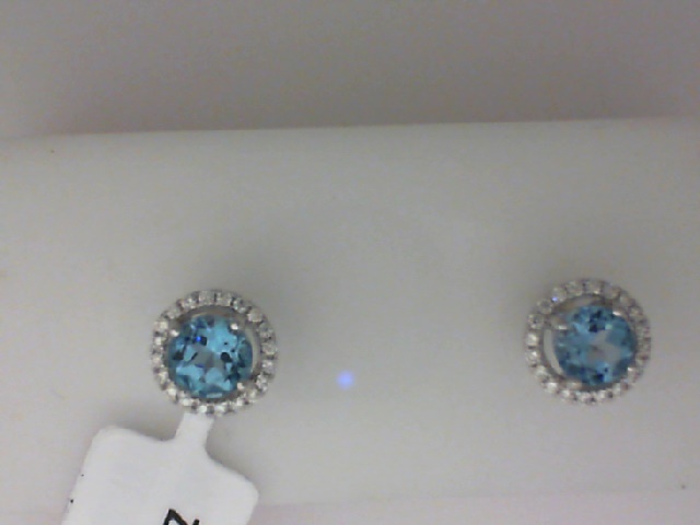 14K WHITE GOLD POST EARRINGS WITH 1.16CTTW ROUND BLUE TOPAZ WITH .15CTTW ROUND I1 CLARITY & HI COLOR DIAMONDS SET IN THE HALOS