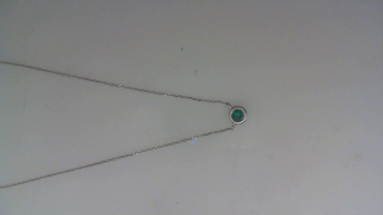 14K WHITE GOLD .08CT BEZEL SET EMERALD PENDANT ON AN 18