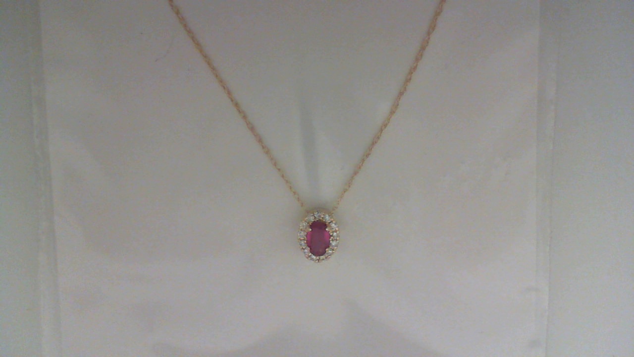 14K YELLOW GOLD .22CT OVAL RUBY PENDANT WITH .10CTTW ROUND I1 CLARITY & HI COLOR DIAMONDS SET IN THE HALO ON A PENDANT CHAIN